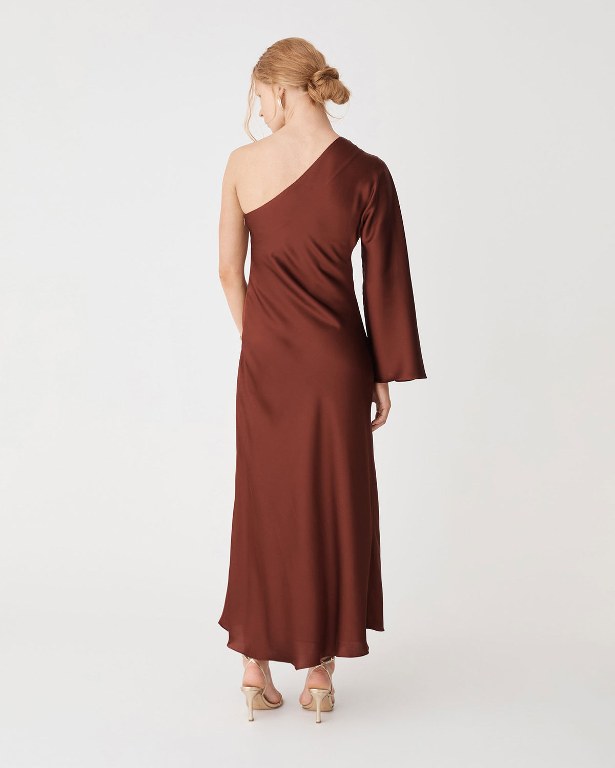 Cleo One Shoulder Satin Dress in brick — back view