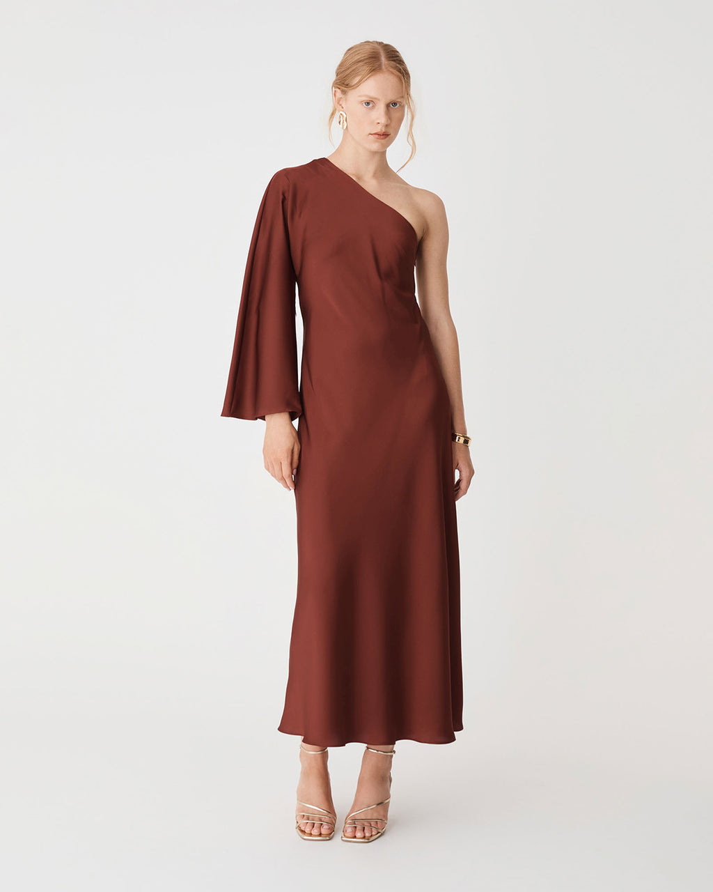 Cleo One Shoulder Satin Dress in brick — full-length view