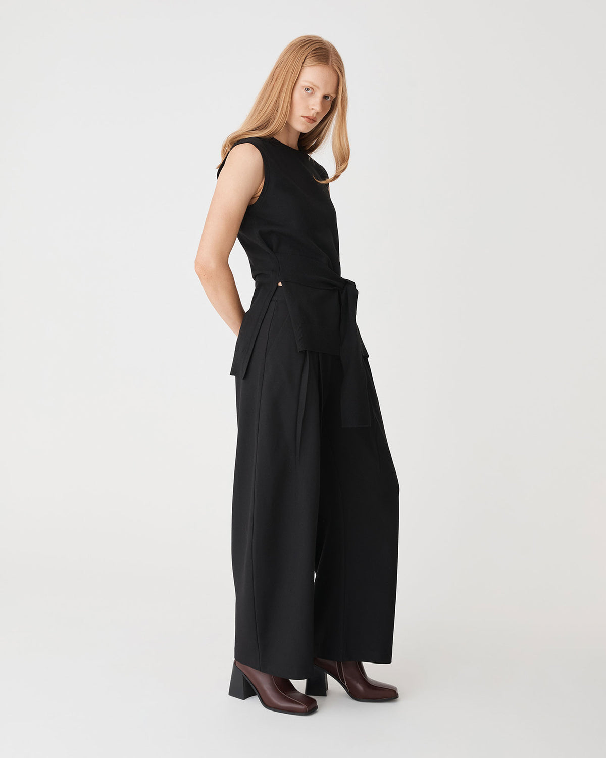 Nora Sleeveless Tie Waist Knit in black — side view