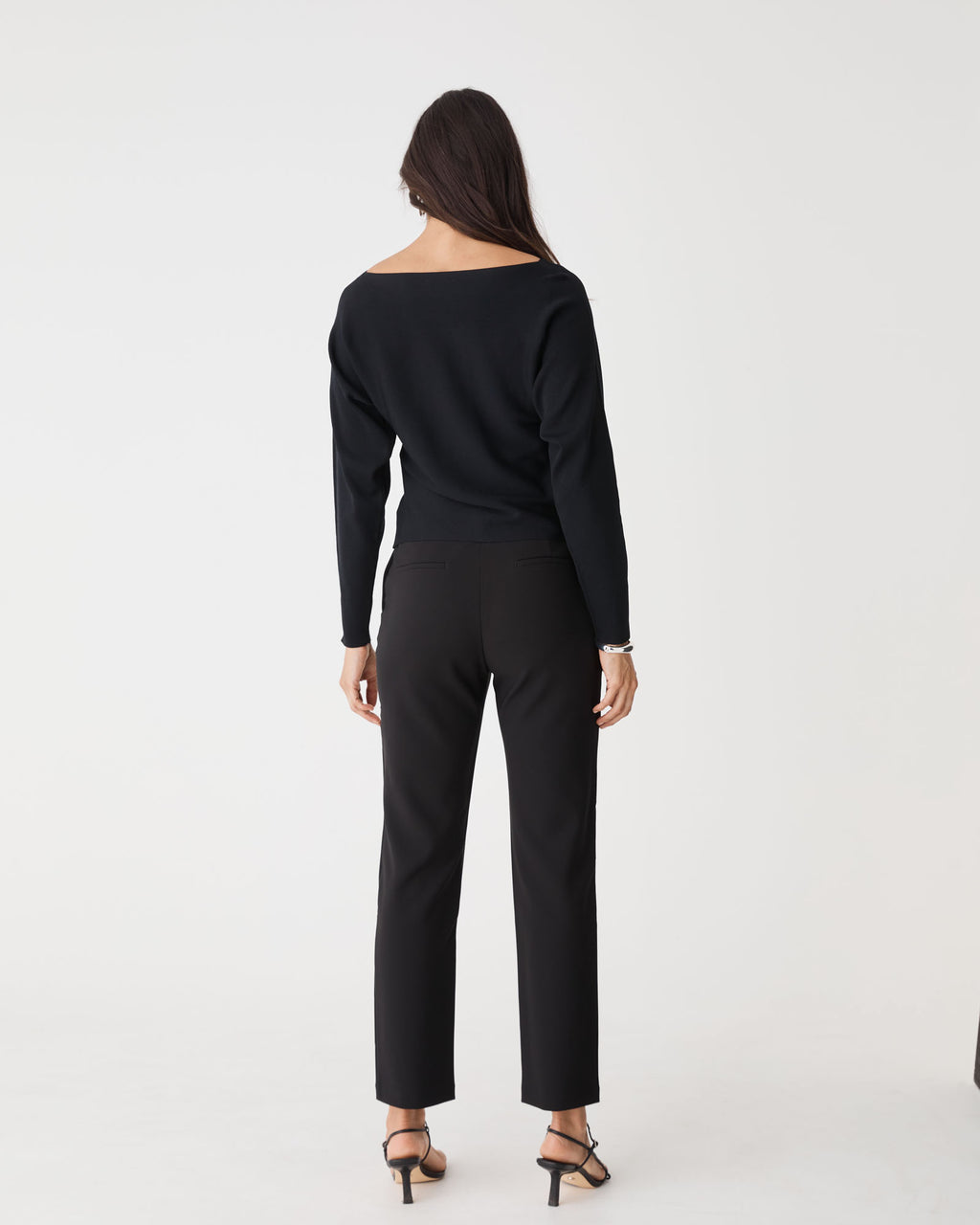 Jamie Dolman Sleeve Knit in black — back view