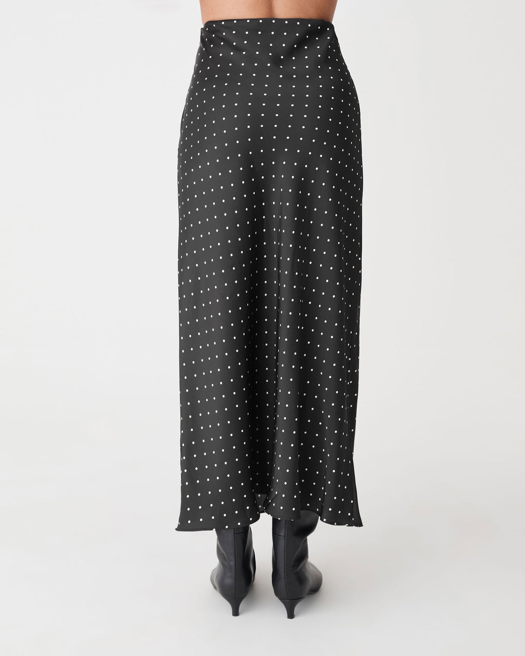 Courtney Bias Satin Skirt in black white dot — back view