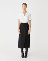 Lydia Faux Wrap Skirt in black — full-length view
