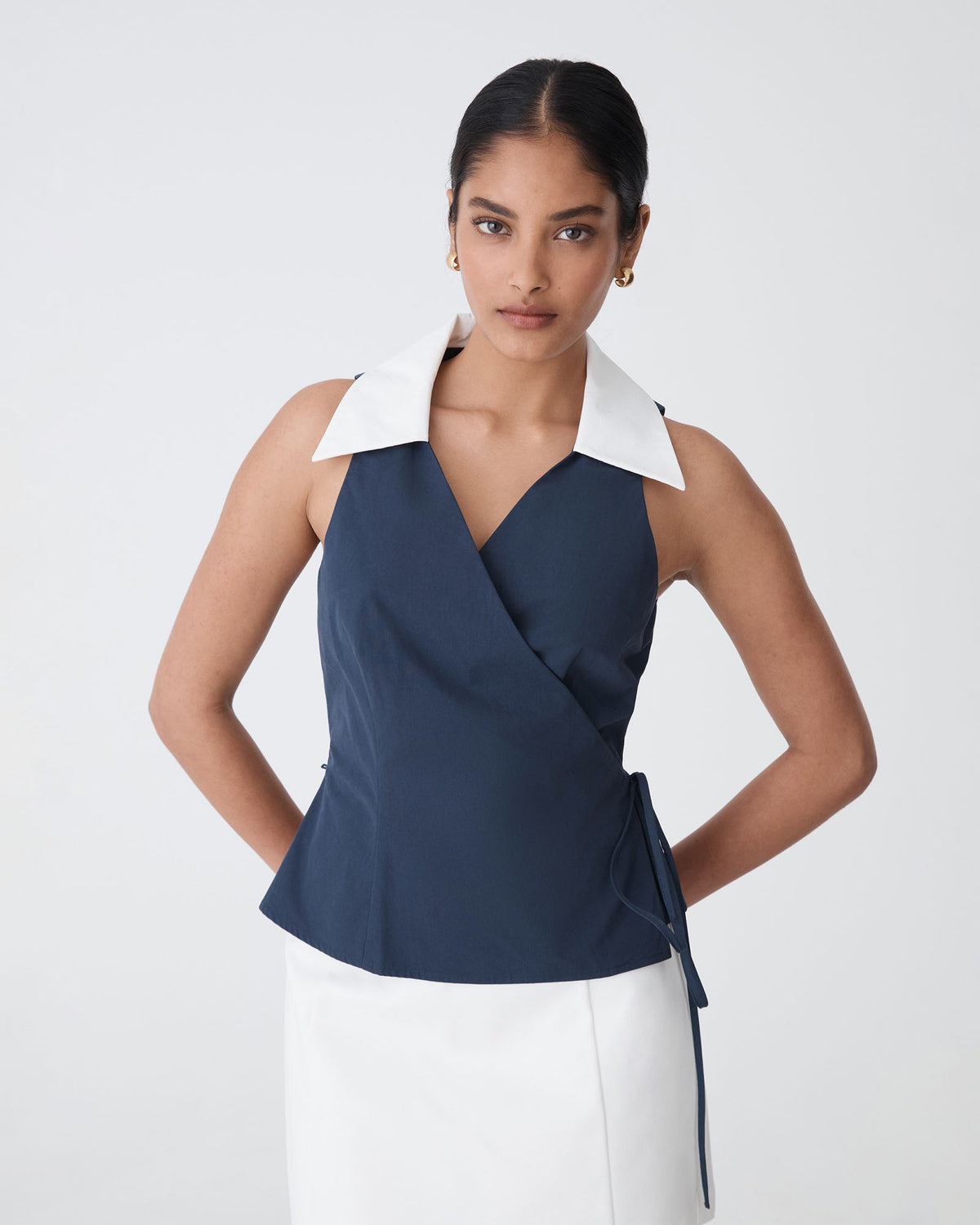 Layla Collared Wrap Top in navy white — close-up view