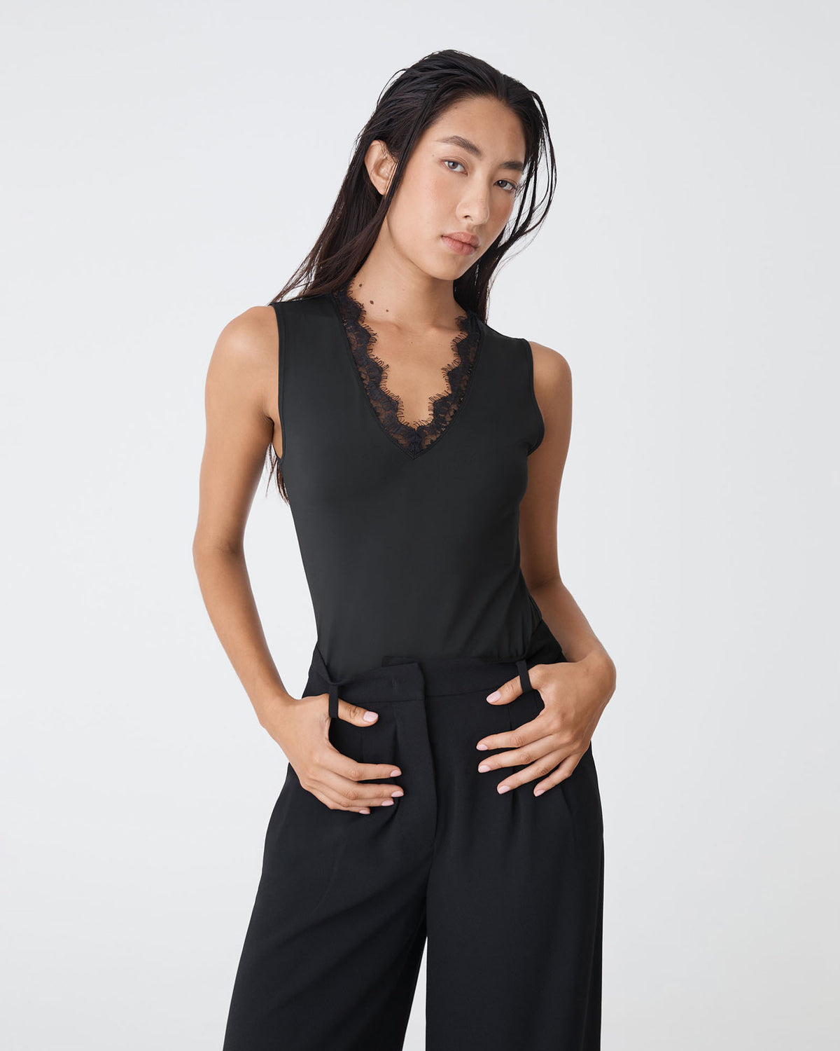 Greer Lace Trim Cami in black — close-up view