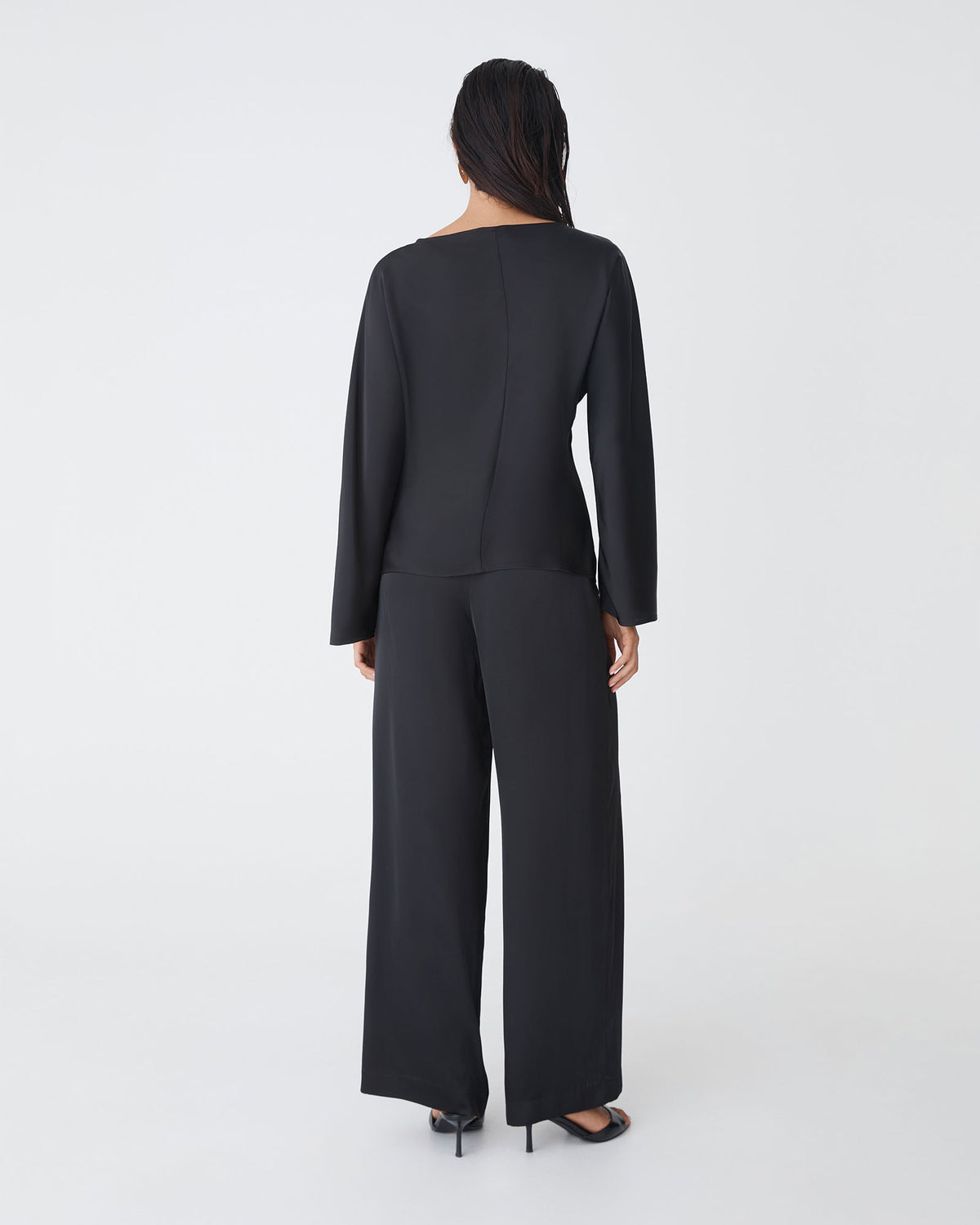 Asma Satin Bias Top in black — back view