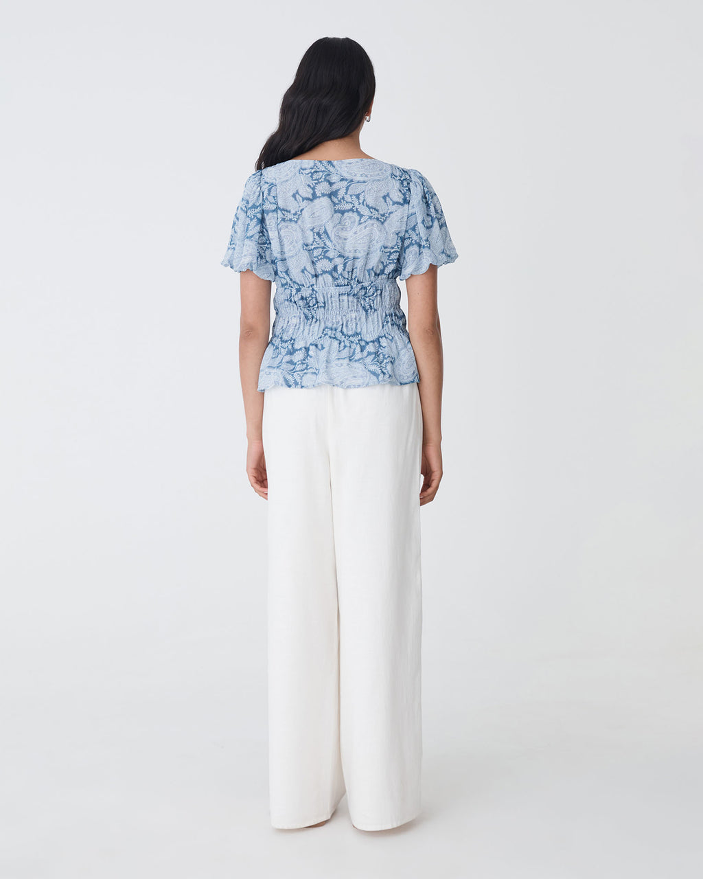 Angie Elastic Waist Top in blue paisley — back view
