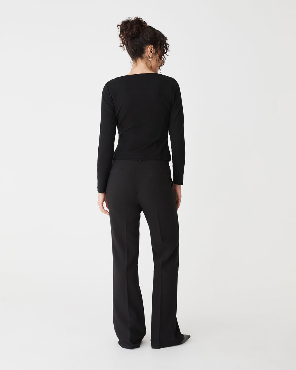 Calia Asymmetric Knit Top in black — back view