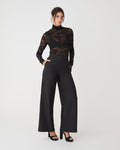 Torin Lace Turtleneck Top in black — full-length view