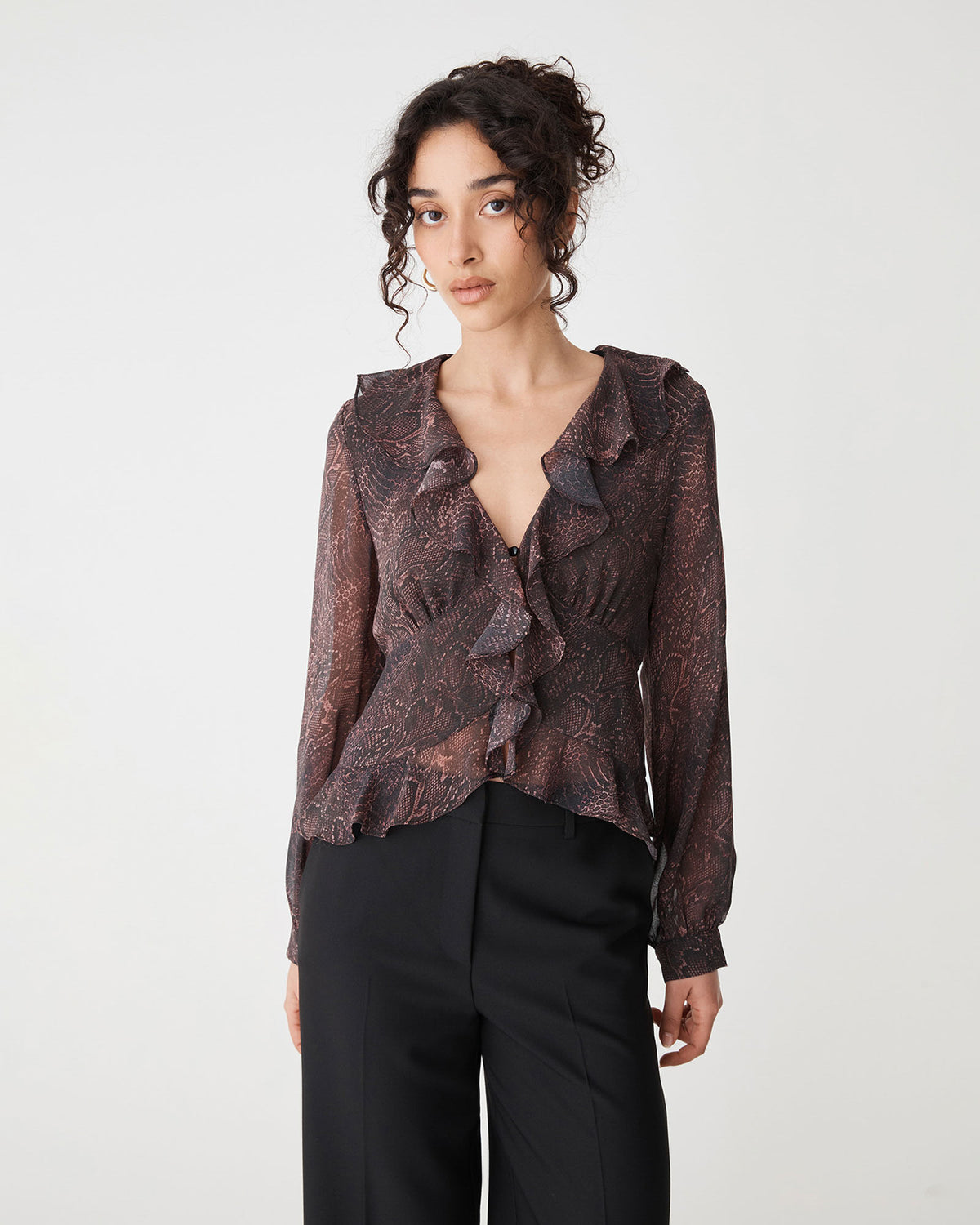 Sonia V-Neck Ruffle Top in brown snake — close-up view