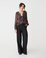 Sonia V-Neck Ruffle Top in brown snake — full-length view