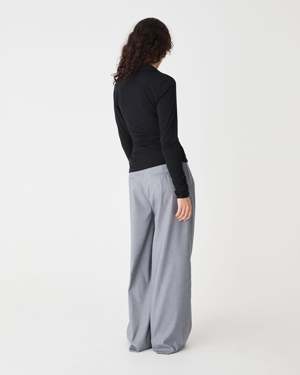 Solene Bamboo Wrap Top in black — back view