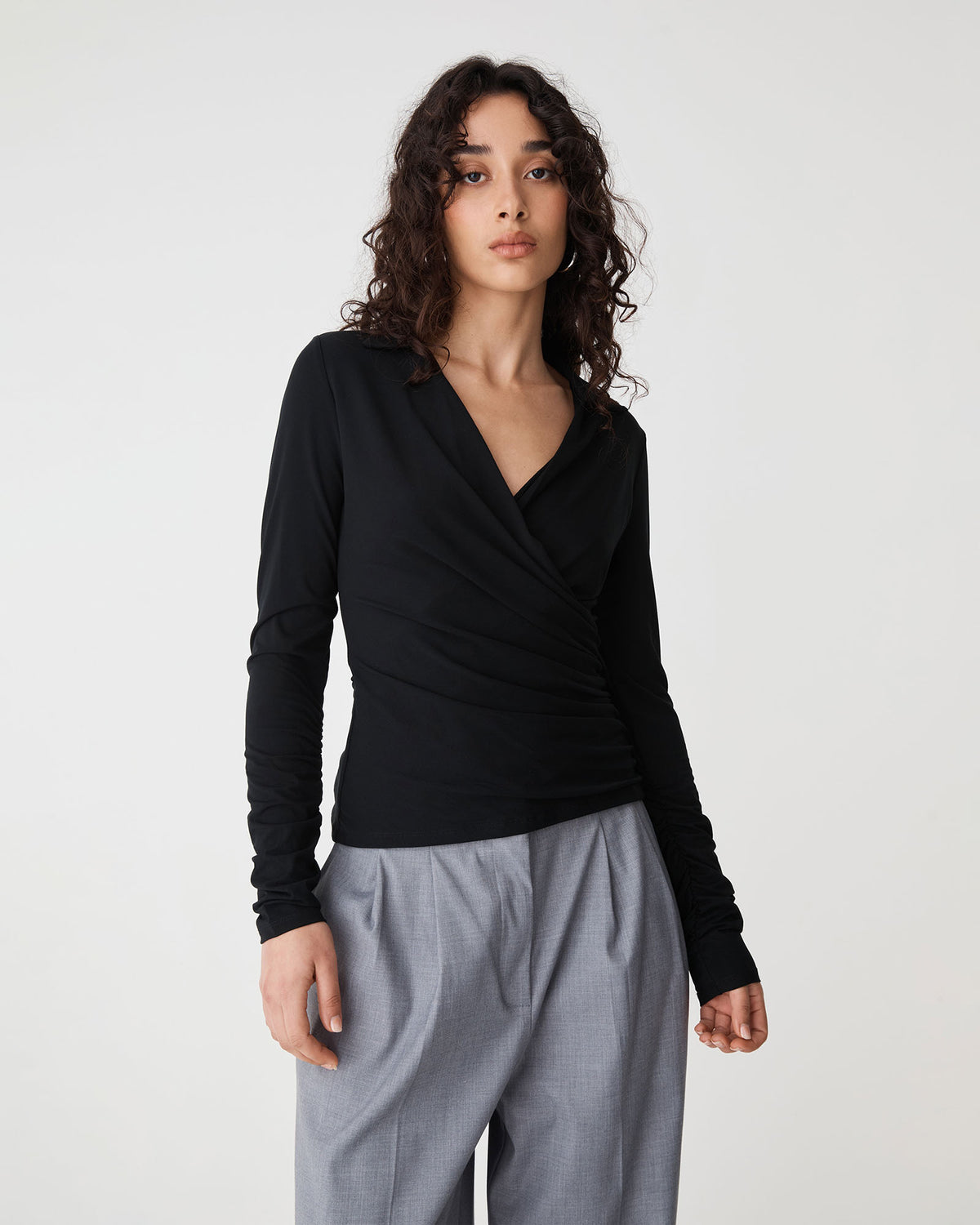 Solene Bamboo Wrap Top in black — close-up view 2
