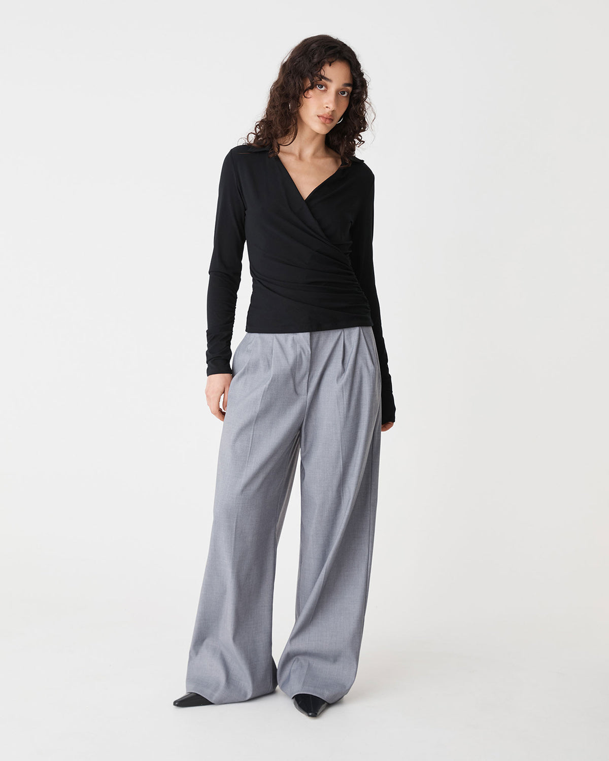 Solene Bamboo Wrap Top in black — full-length view