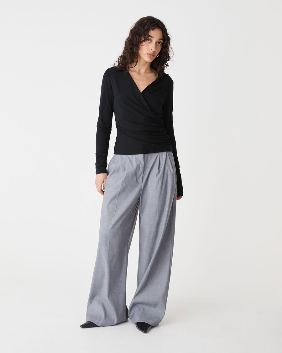 Solene Bamboo Wrap Top in black — full-length view
