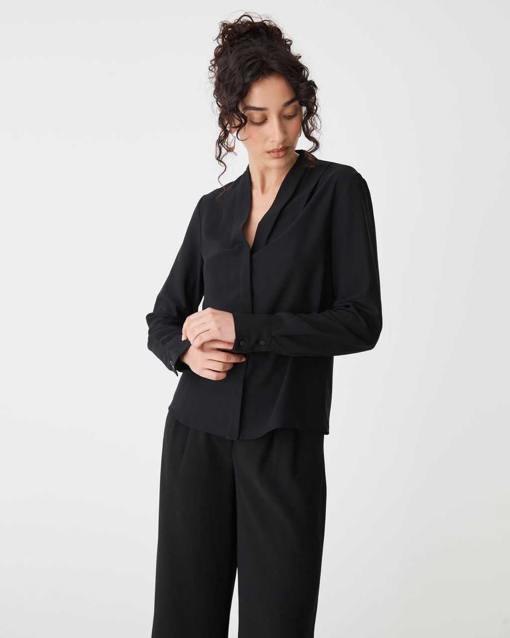 Claudia Pleat Neck Blouse in black — close-up view