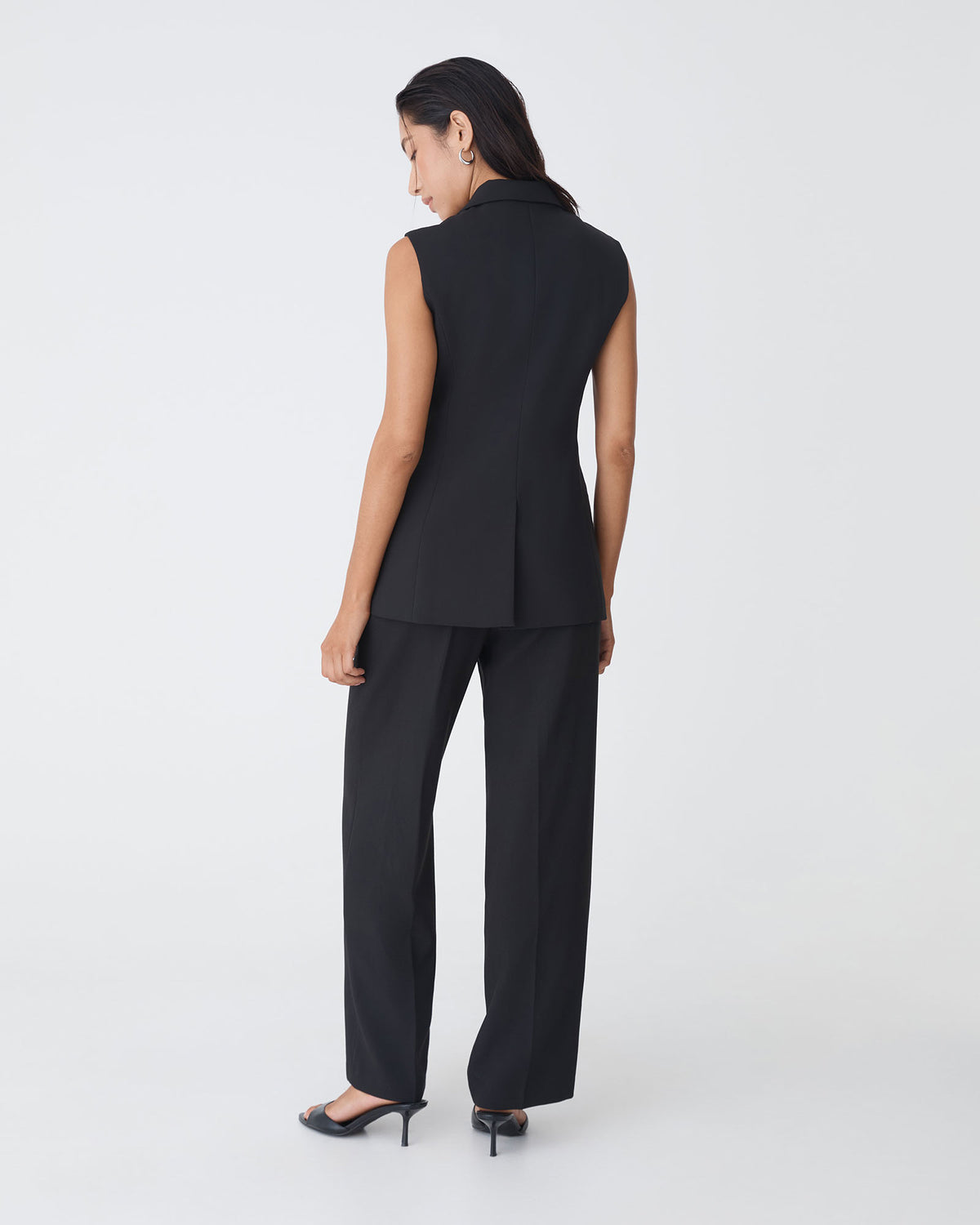 Nikki Long Collared Vest in black — back view