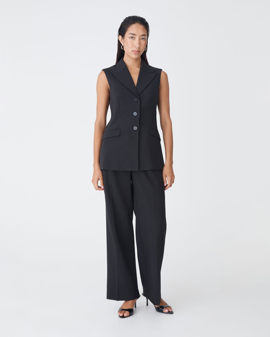 Nikki Long Collared Vest in black — full-length view