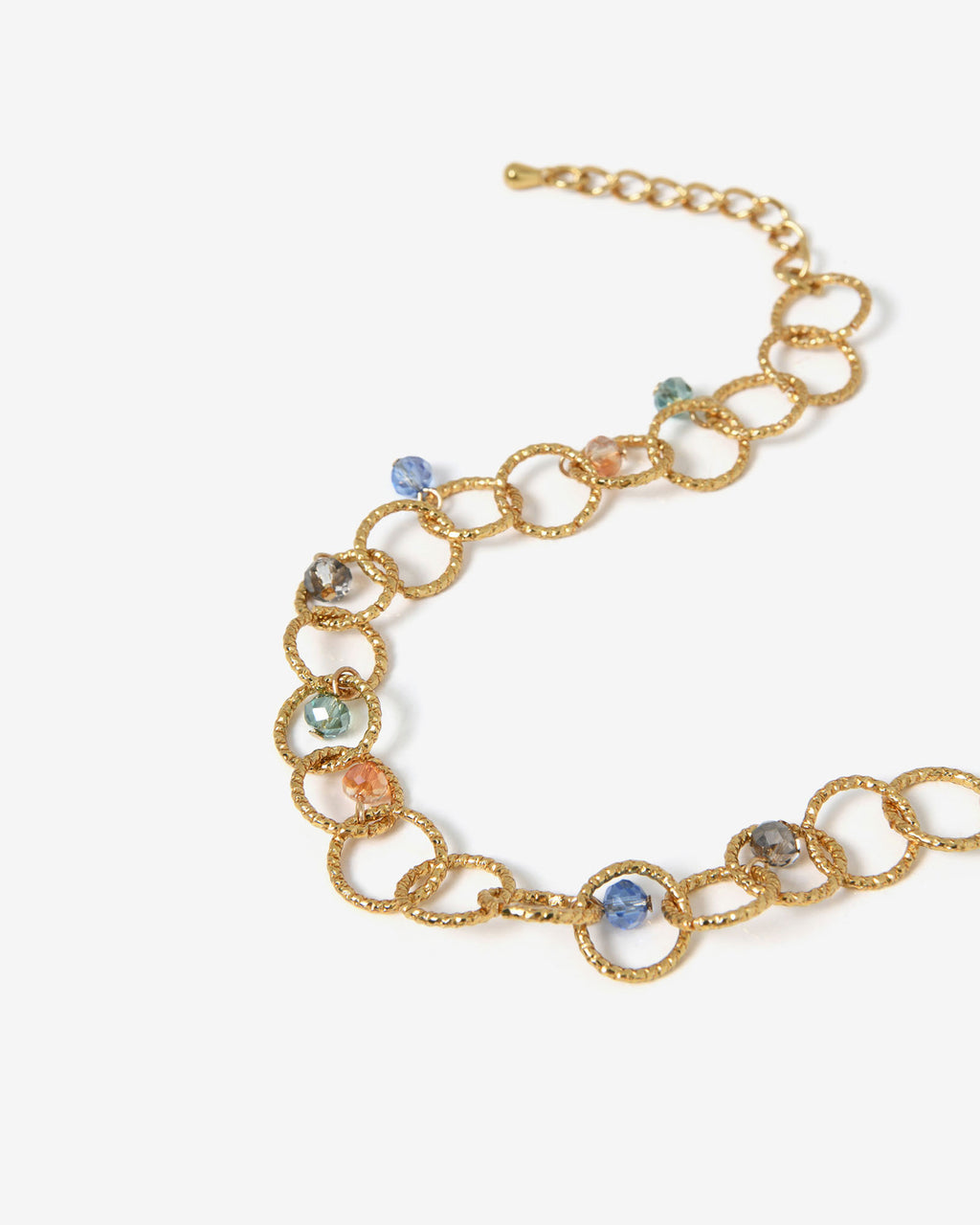 Amaris Crystal Chain Bracelet in gold — fabric detail