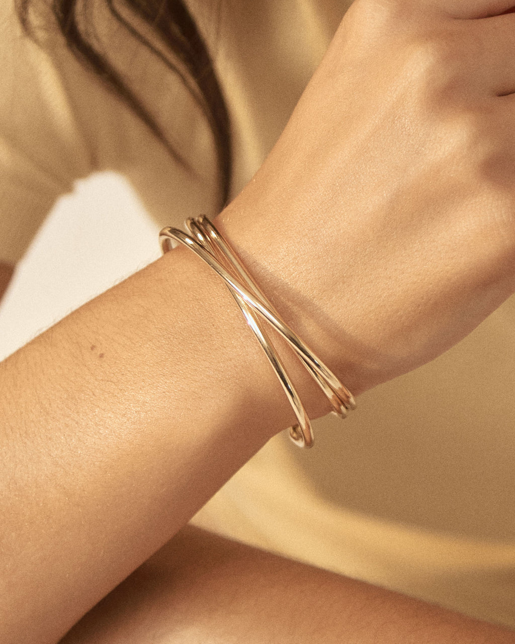 Elara Crossover Cuff in gold — close-up view