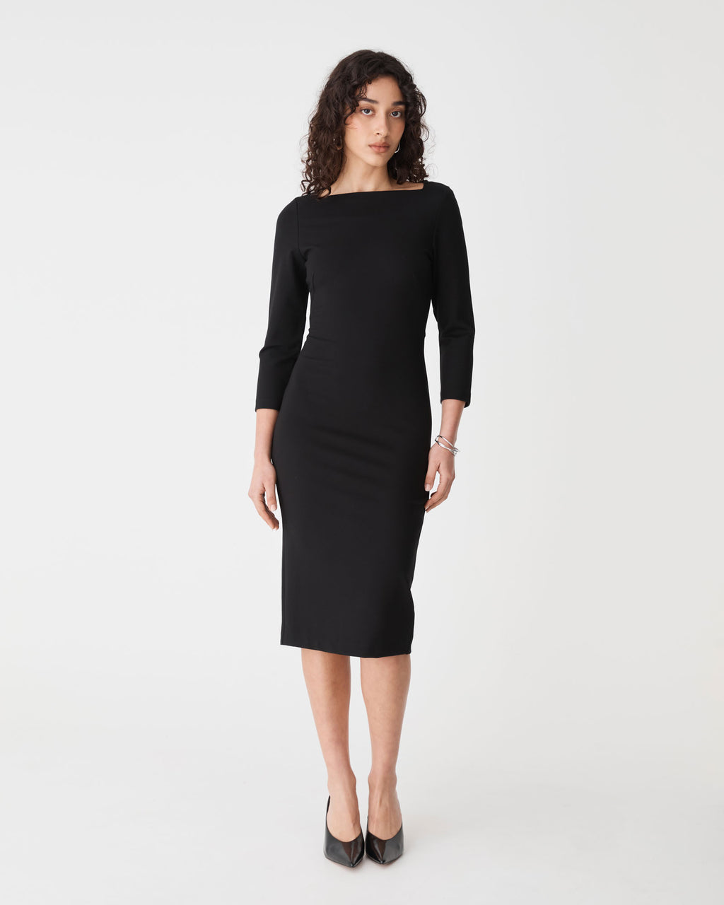 Sutton Ponte Dress in black — full-length view