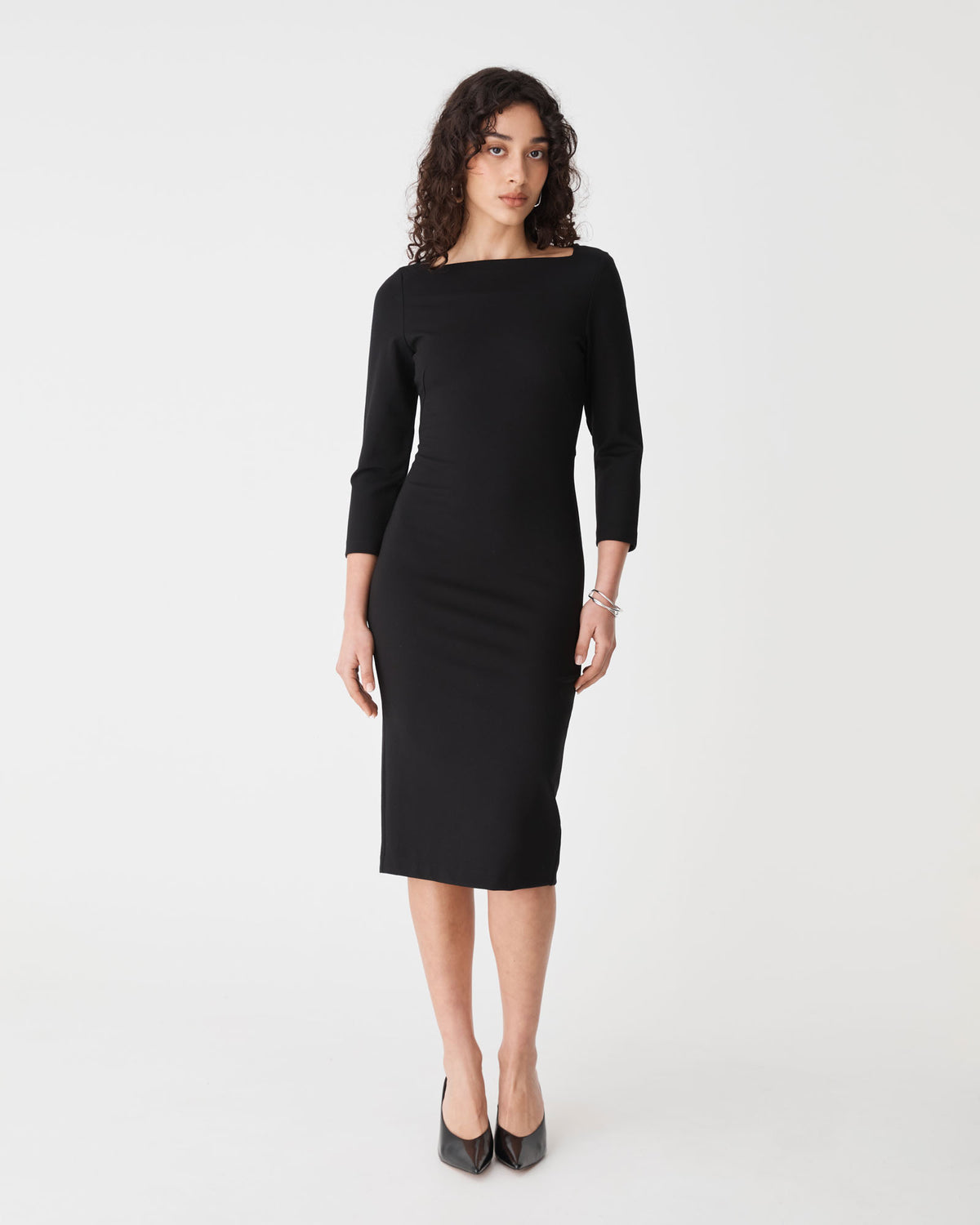 Sutton Ponte Dress in black — full-length view