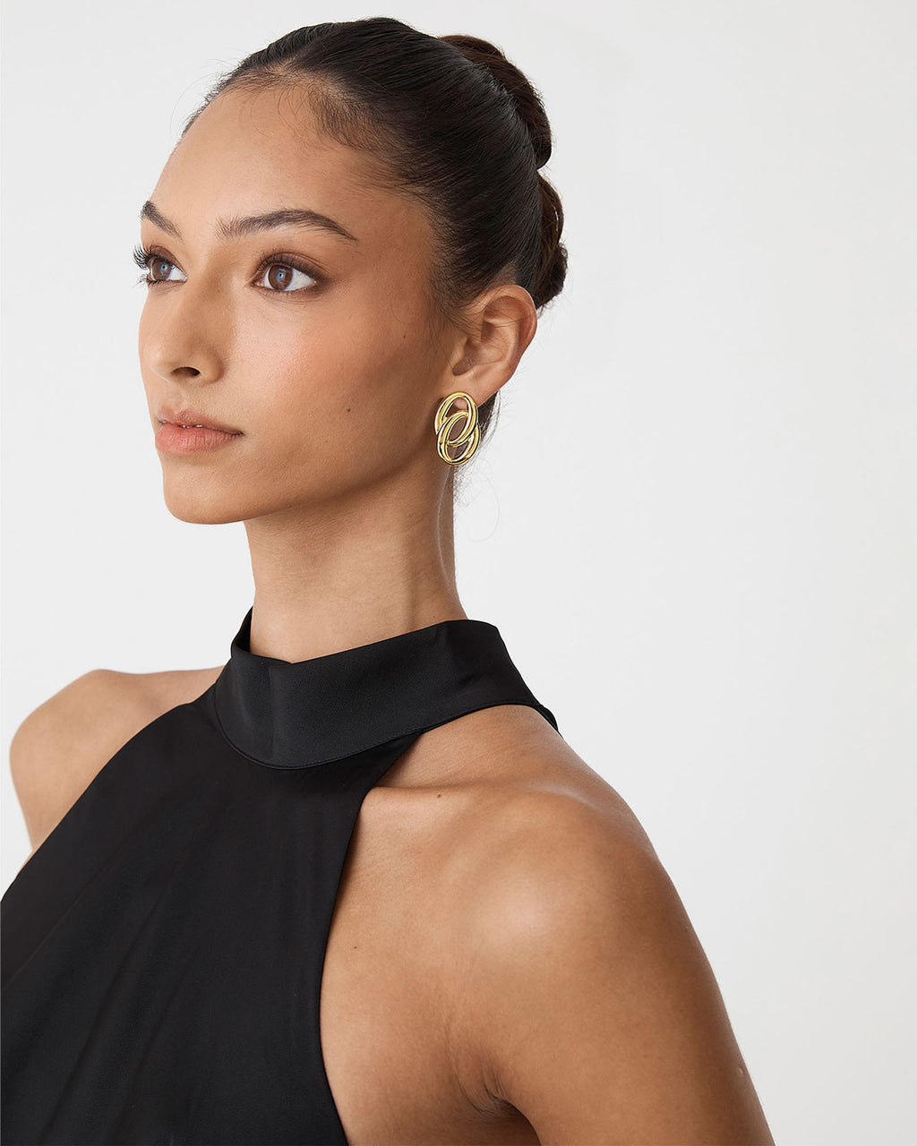 Lupita Gold Loop Earrings in gold — fabric detail