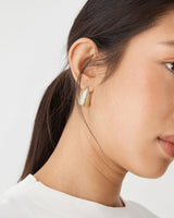 Nora Ribbed Earrings in gold — fabric detail