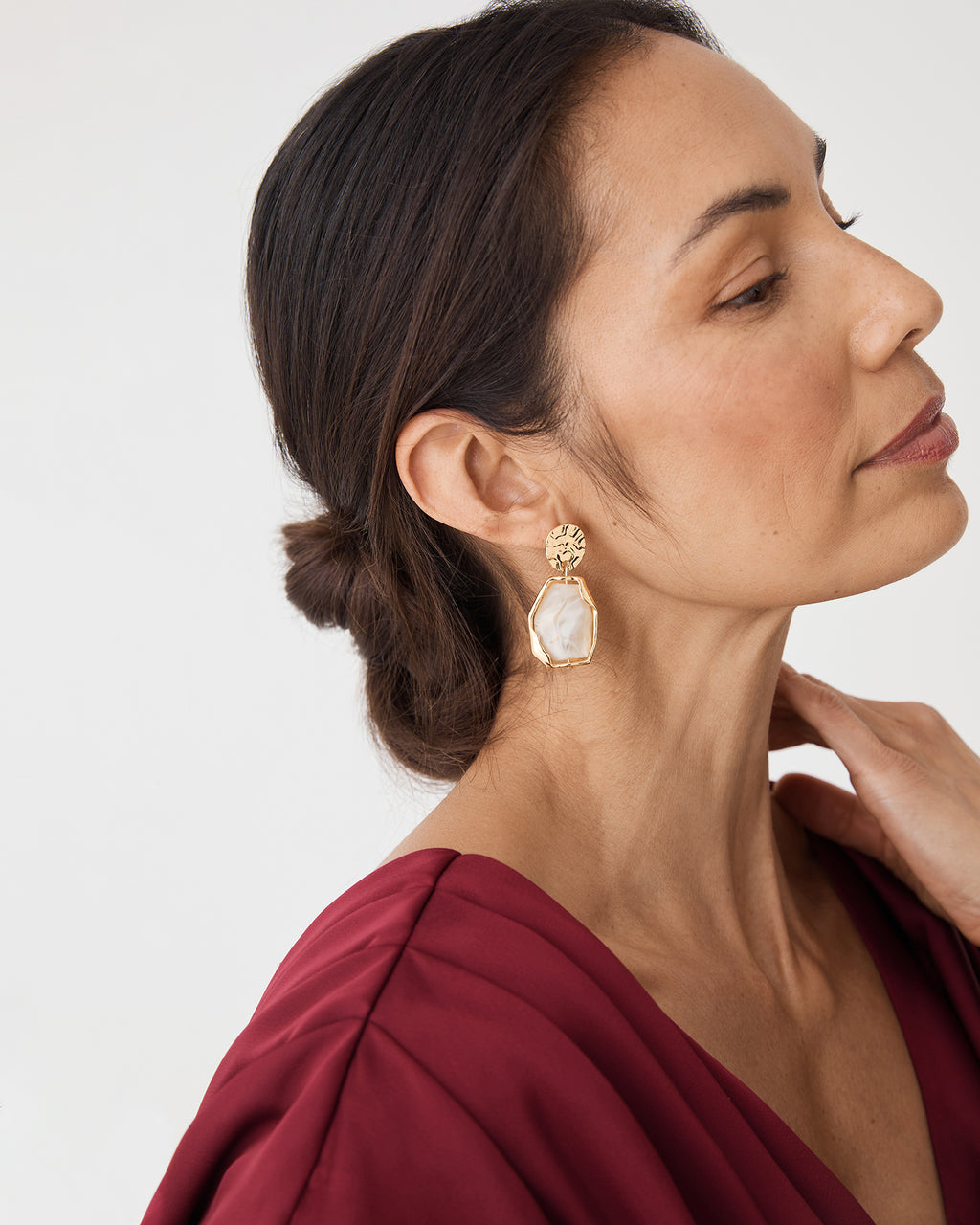 Marbel Gold Earrings in gold — fabric detail