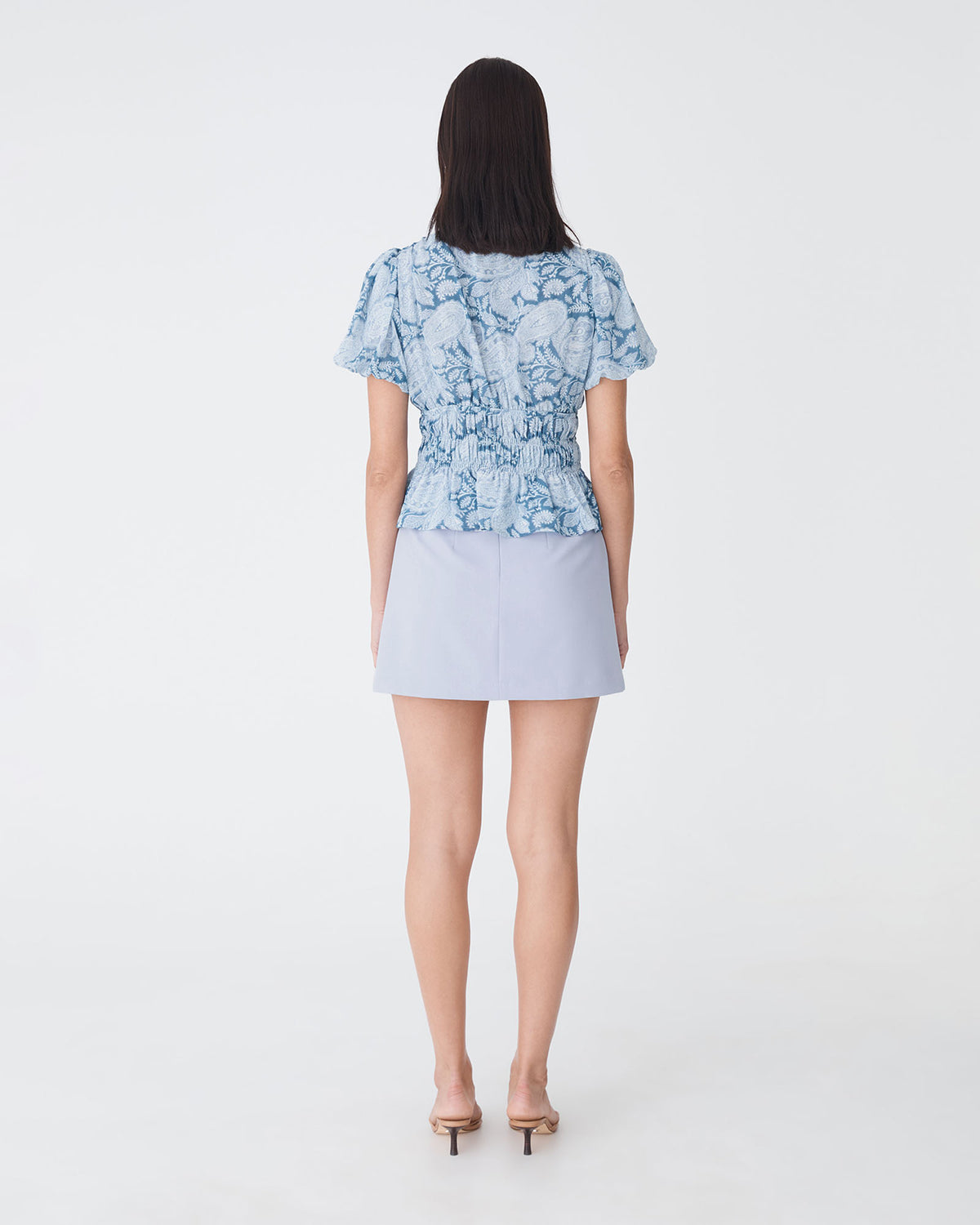 Nikki Mini Wrap Skirt in dusk blue — back view