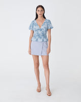 Nikki Mini Wrap Skirt in dusk blue — full-length view