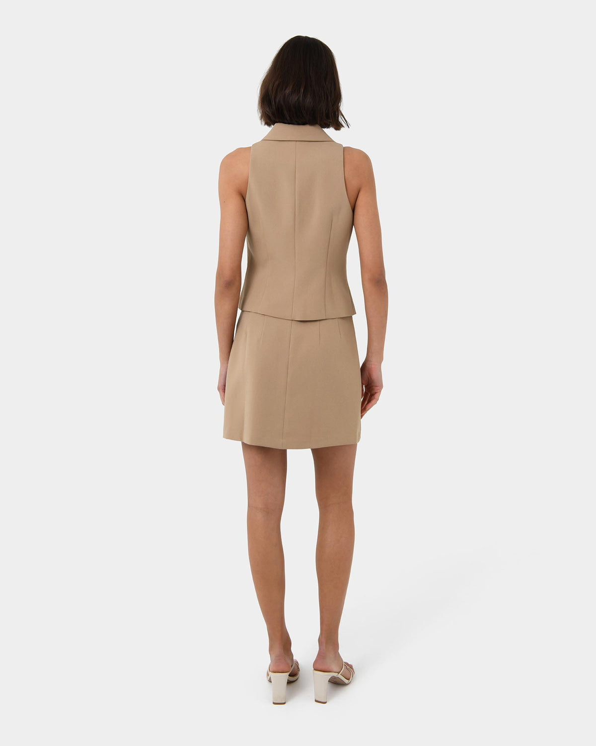 Nikki Mini Wrap Skirt in warm taupe — back view