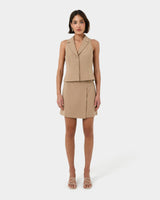 Nikki Mini Wrap Skirt in warm taupe — full-length view