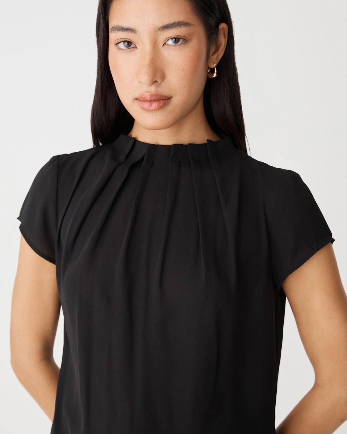 Olivia Pleated High Neck Top in black — fabric detail