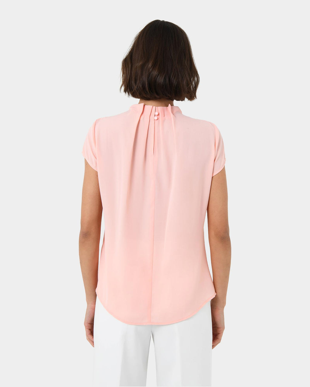 Olivia Pleated High Neck Top in pastel peach — back view