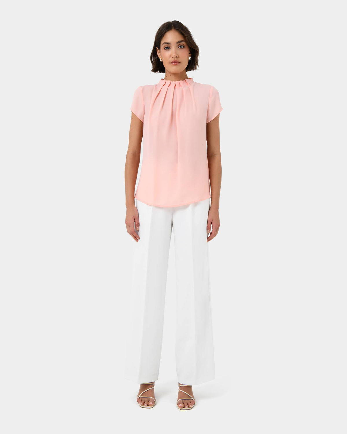 Olivia Pleated High Neck Top in pastel peach — full-length view