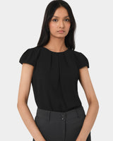 Tamera Pleated Round Neck Top in black — close-up view